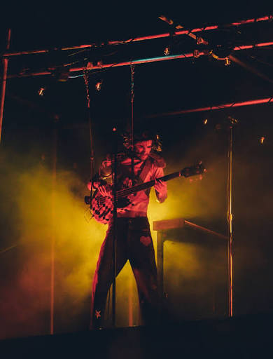 Mike Sabath performing in amber haze