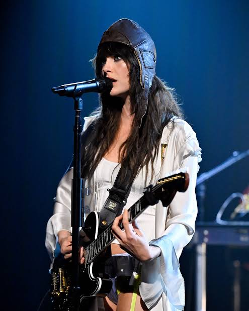 Cara Delevingne singing with guitar on The Tonight Show