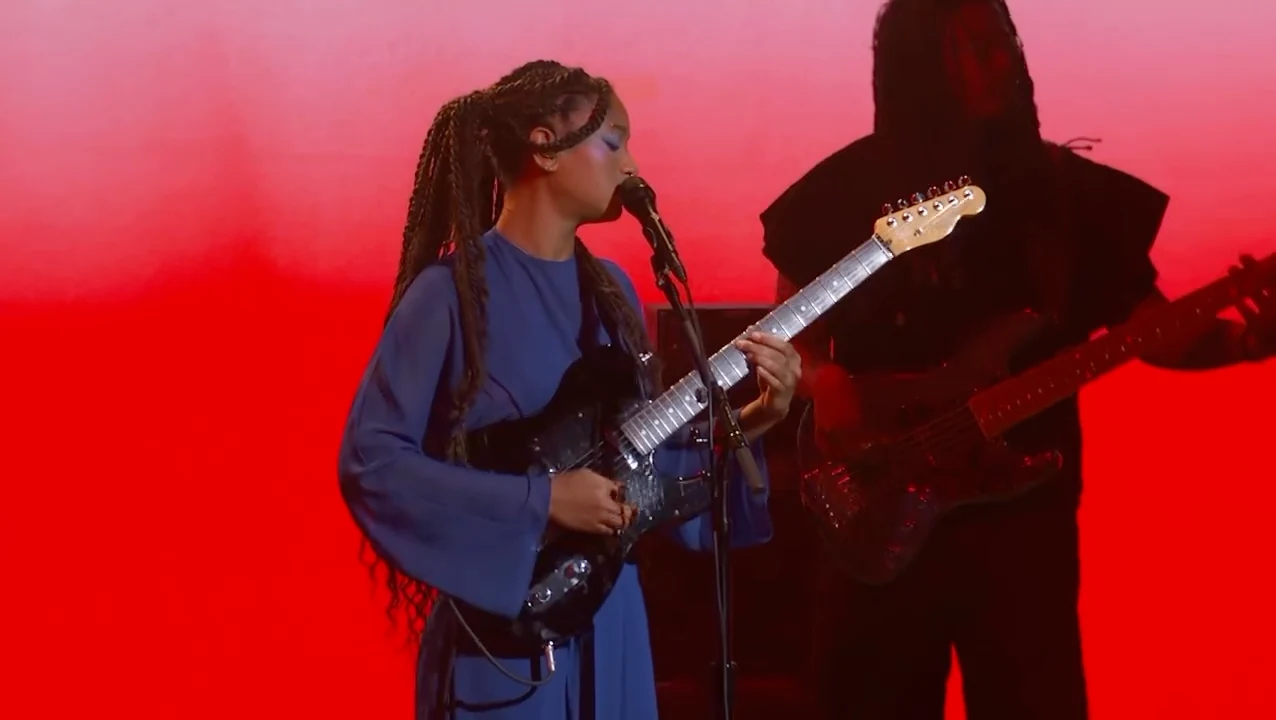 WILLOW singing and playing guitar