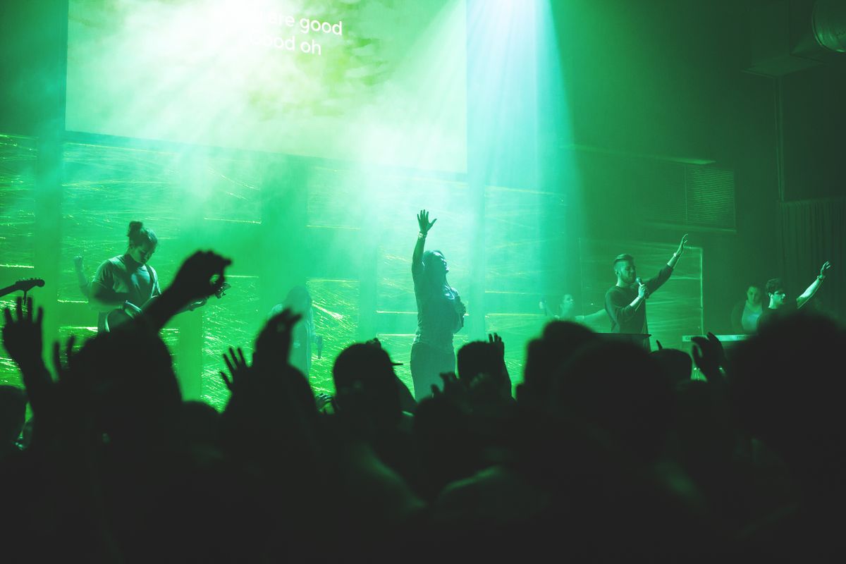 Worship band performing on stage with a live sound system
